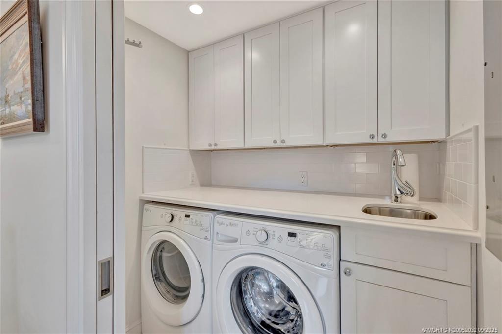 2001 Southeast Sailfish Point Boulevard, Unit 303 Stuart, FL 34996 - Photo 26 of 63 a view of livingroom with washer and dryer
