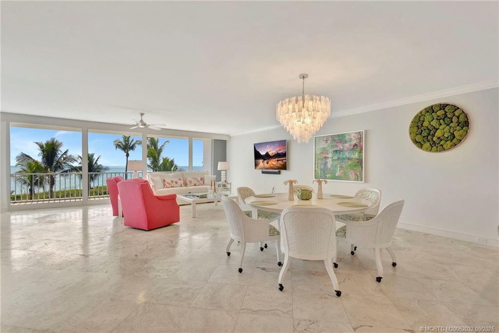 2001 Southeast Sailfish Point Boulevard, Unit 303 Stuart, FL 34996 - Photo 6 of 63 a view of a dining room with furniture window and outside view