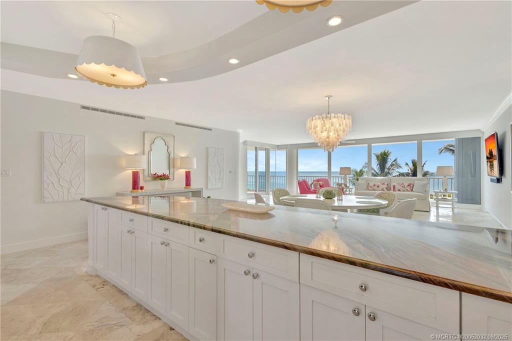 2001 Southeast Sailfish Point Boulevard, Unit 303 Stuart, FL 34996 - Photo 8 of 63 a bathroom with a sink and a mirror