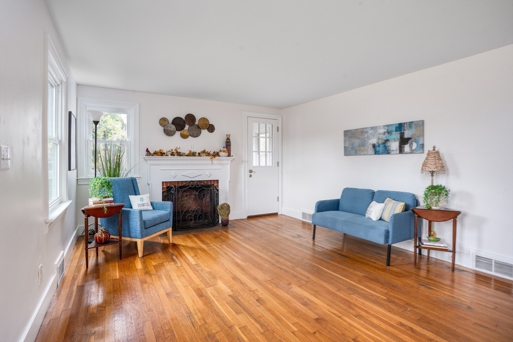 142 Amherst Street Ludlow, MA 01056 - Photo 11 of 34 a living room with furniture and a fireplace