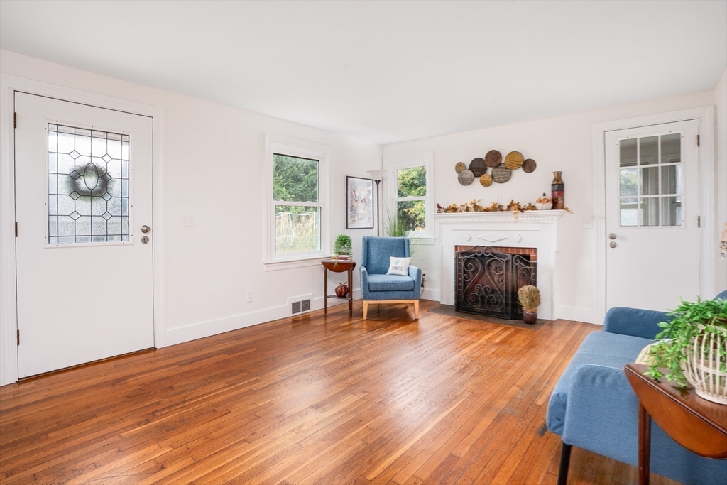 142 Amherst Street Ludlow, MA 01056 - Photo 12 of 34 a living room with furniture and a fireplace