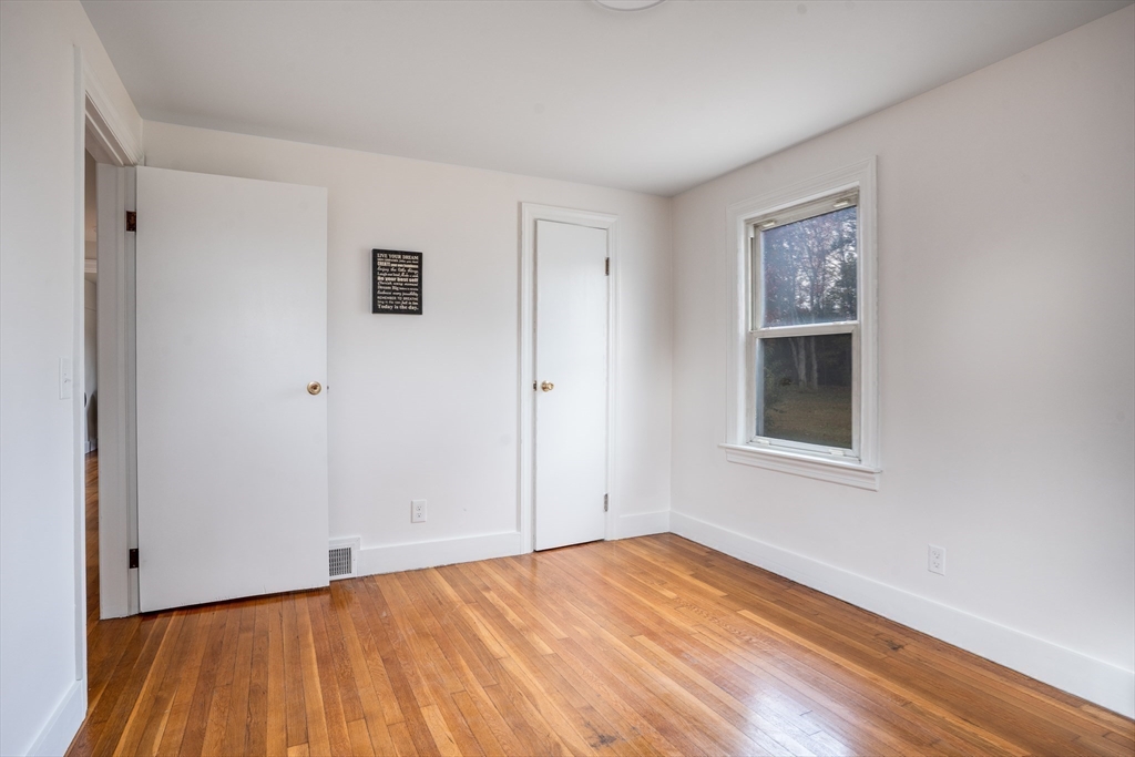 142 Amherst Street Ludlow, MA 01056 - Photo 15 of 34 a view of empty room with wooden floor and fan