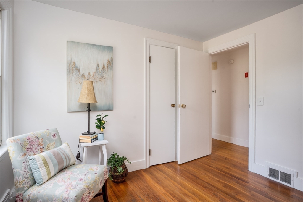 142 Amherst Street Ludlow, MA 01056 - Photo 19 of 34 a living room with furniture and a wooden floor