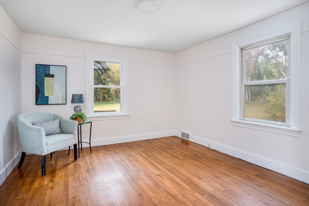 142 Amherst Street Ludlow, MA 01056 - Photo 22 of 34 a view of an empty room with wooden floor and a window