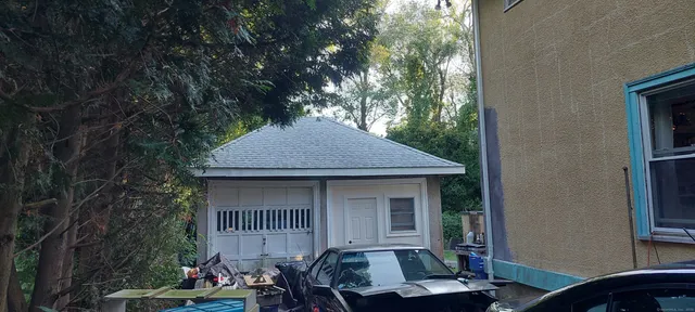 a backyard of a house with seating space