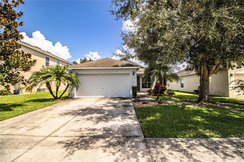 241 Grove Branch Road Winter Haven, FL 33880 - Photo 2 of 31 a view of a house with a yard
