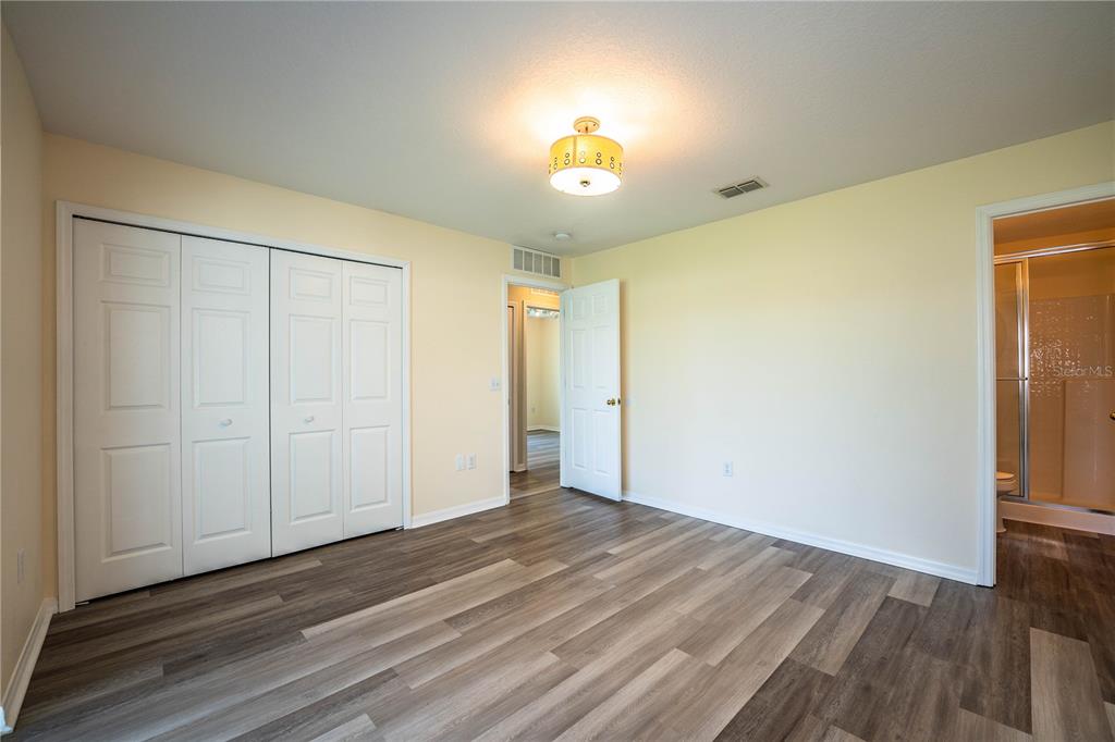 241 Grove Branch Road Winter Haven, FL 33880 - Photo 23 of 31 a view of empty room with wooden floor