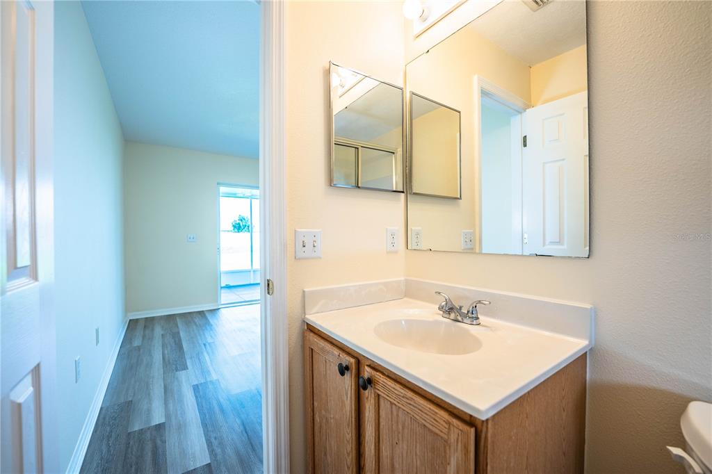 241 Grove Branch Road Winter Haven, FL 33880 - Photo 25 of 31 a bathroom with a sink and a mirror