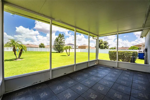 a view of an empty room and window