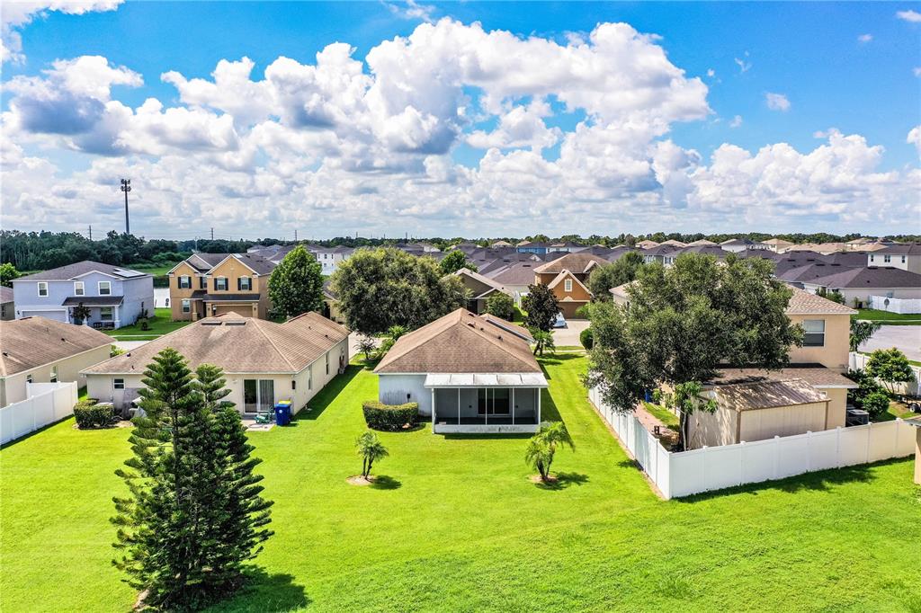241 Grove Branch Road Winter Haven, FL 33880 - Photo 28 of 31 a view of a house with a big yard