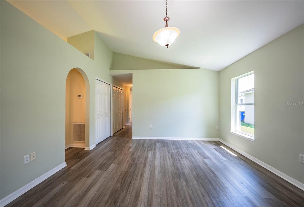 241 Grove Branch Road Winter Haven, FL 33880 - Photo 6 of 31 wooden floor in an empty room with a window