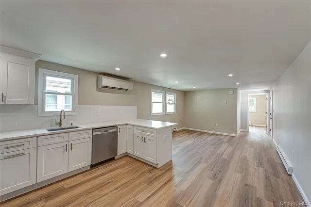 a view of a hallway with washer and dryer