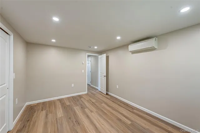 a view of room with wooden floor