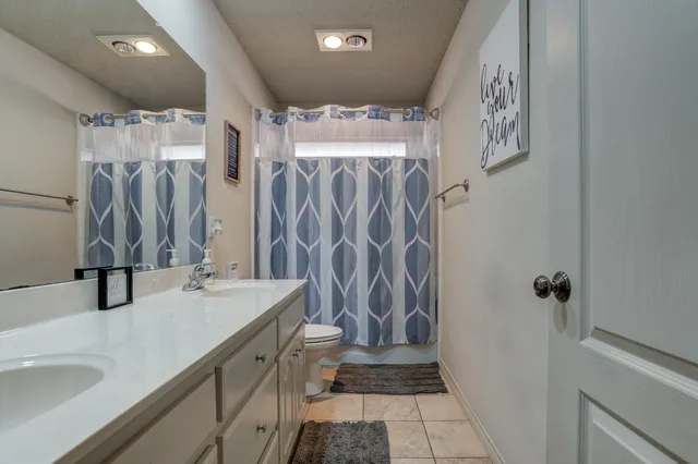 a bathroom with a sink and a shower