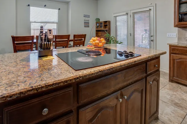 a building outdoor space with patio furniture and potted plants
