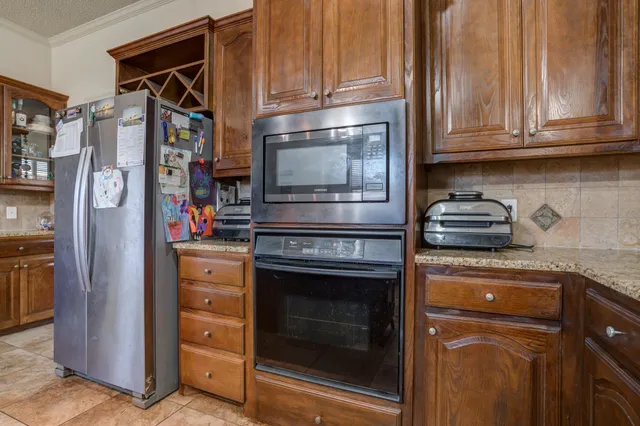 a view of room with window and wooden floor