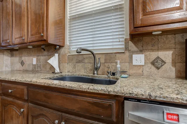 a kitchen with granite countertop lots of counter top space