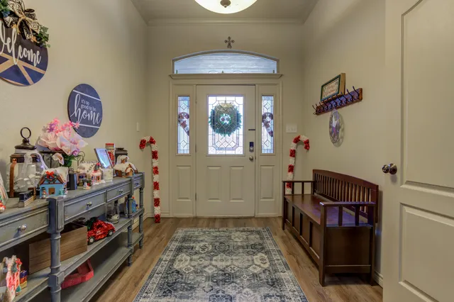 a spacious bathroom with a tub sink and mirror