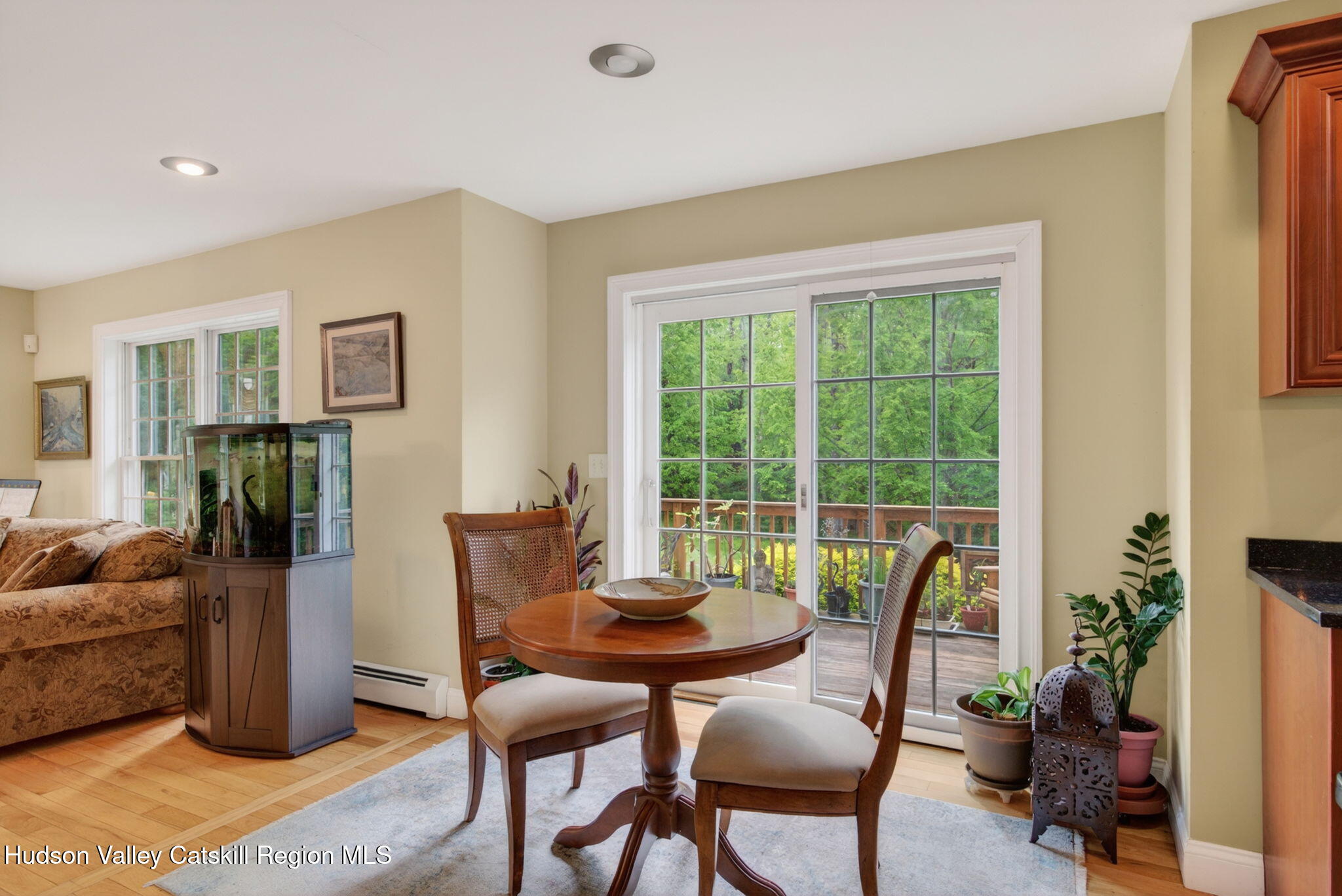 189 Bush Road Stone Ridge, NY 12484 - Photo 17 of 60 a dining room with furniture and potted plants