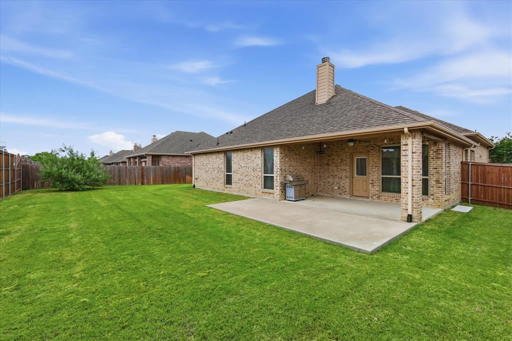 215 Equestrian Road Hickory Creek, TX 75065 - Photo 32 of 36 a front view of a house with yard