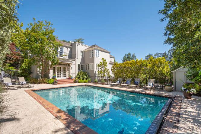 1055 Vista Road Hillsborough, CA 94010 - Photo 1 of 28 a view of a swimming pool with a patio