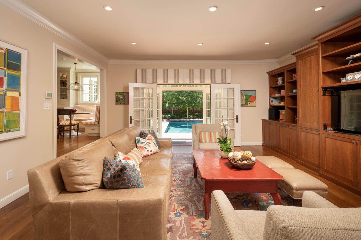 1055 Vista Road Hillsborough, CA 94010 - Photo 11 of 28 a living room with furniture and a book shelf