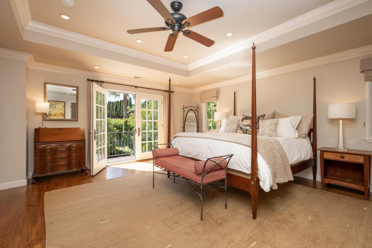 1055 Vista Road Hillsborough, CA 94010 - Photo 13 of 28 a spacious bedroom with a bed flat screen tv and a large window