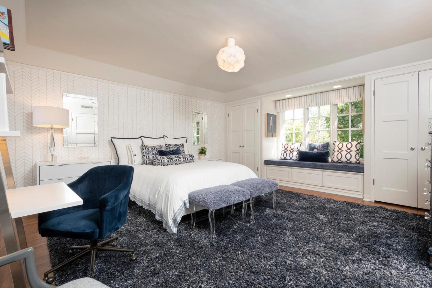 1055 Vista Road Hillsborough, CA 94010 - Photo 17 of 28 a bed room with a bed and a chair