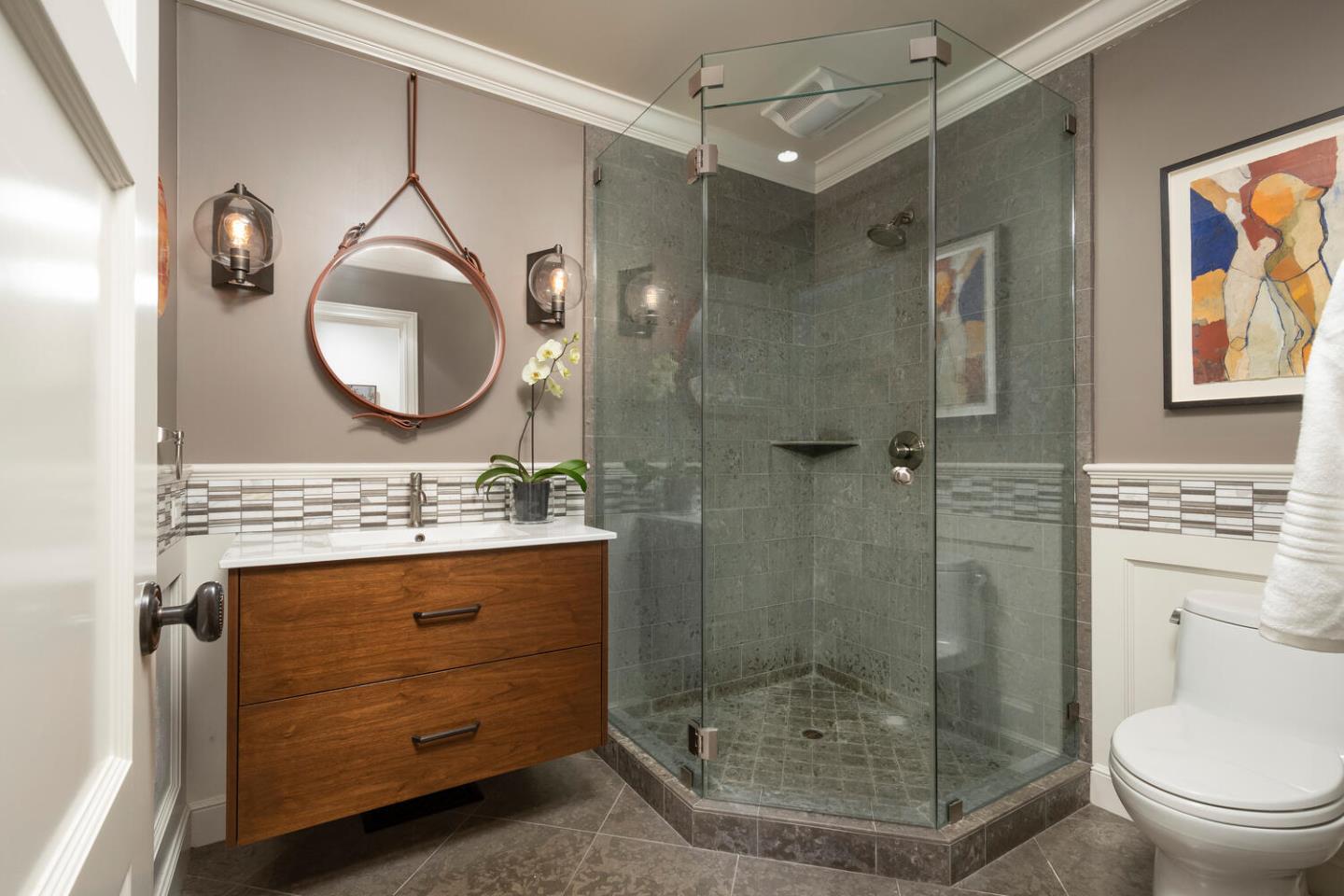 1055 Vista Road Hillsborough, CA 94010 - Photo 18 of 28 a bathroom with a granite countertop sink mirror vanity and toilet