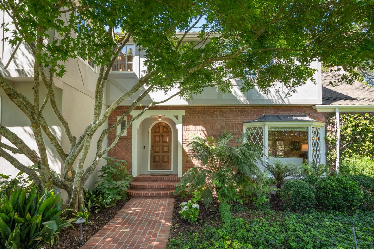 1055 Vista Road Hillsborough, CA 94010 - Photo 3 of 28 front view of a house with a garden