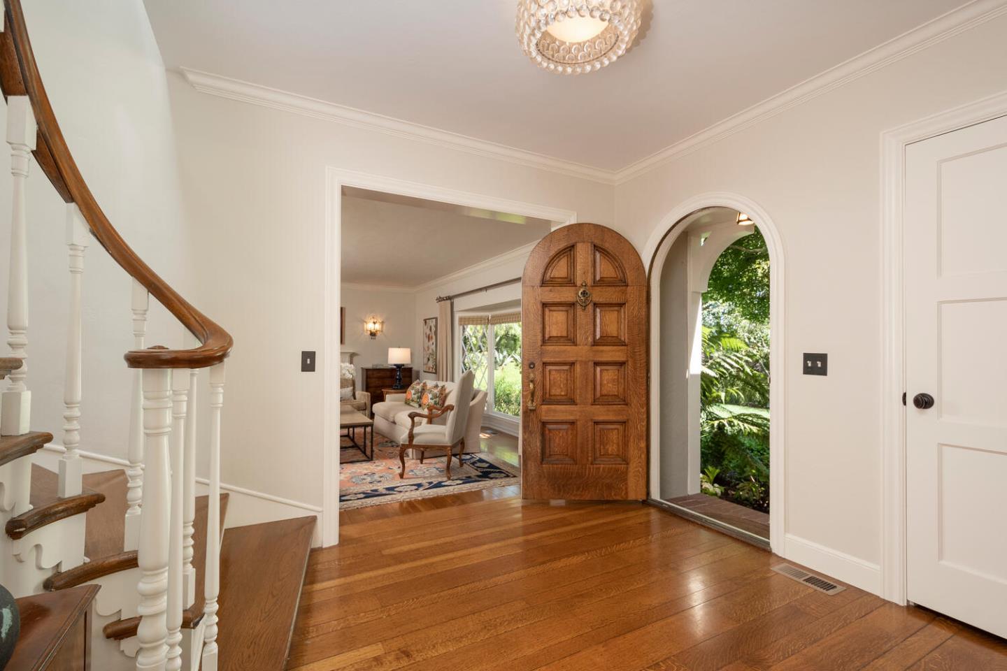 1055 Vista Road Hillsborough, CA 94010 - Photo 4 of 28 a view of an entryway with wooden floor windows and a livingroom