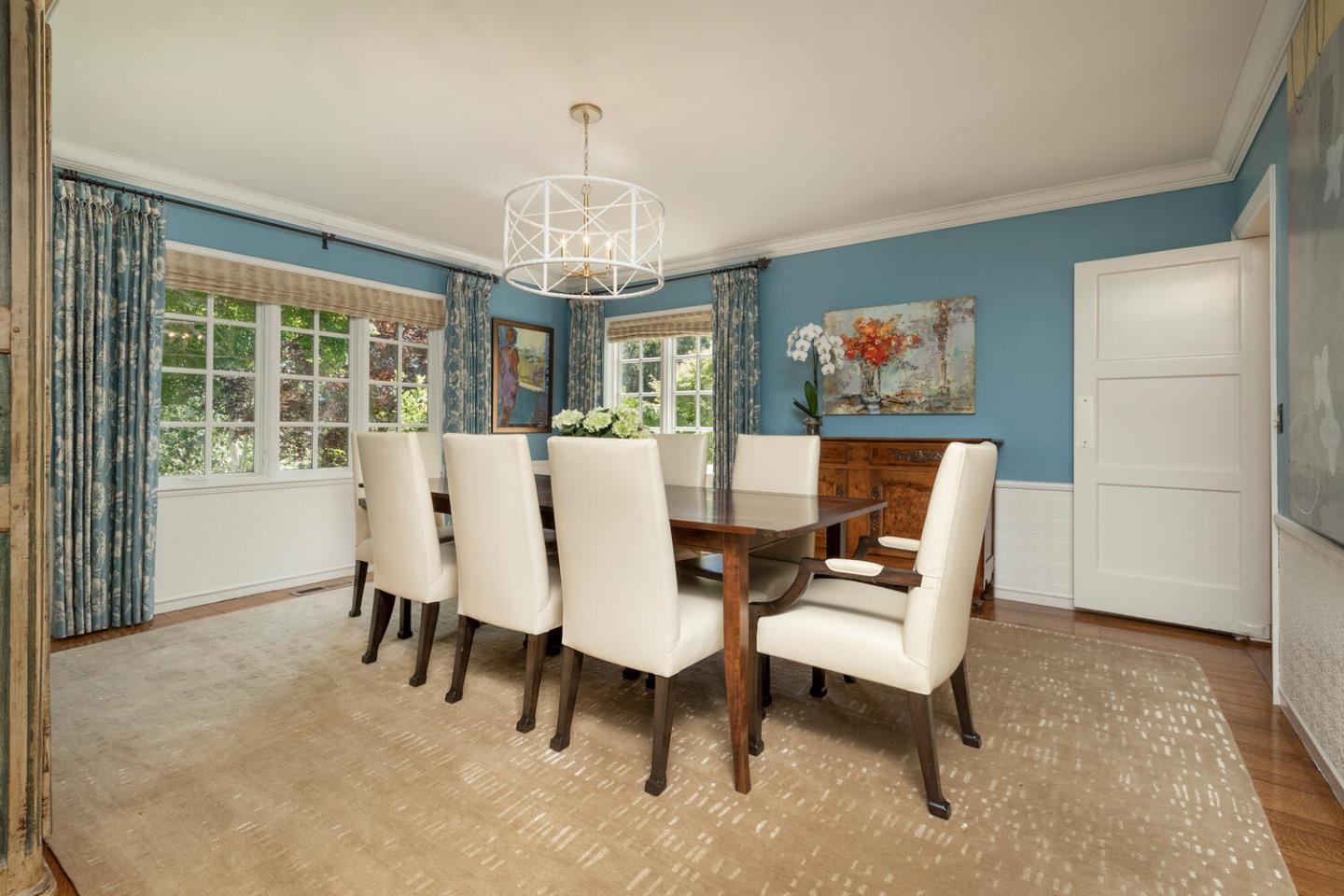 1055 Vista Road Hillsborough, CA 94010 - Photo 6 of 28 a view of a dining room with furniture a chandelier and a window
