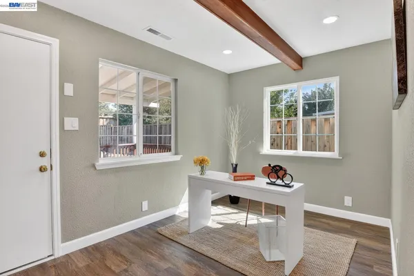 a dining room with furniture and window