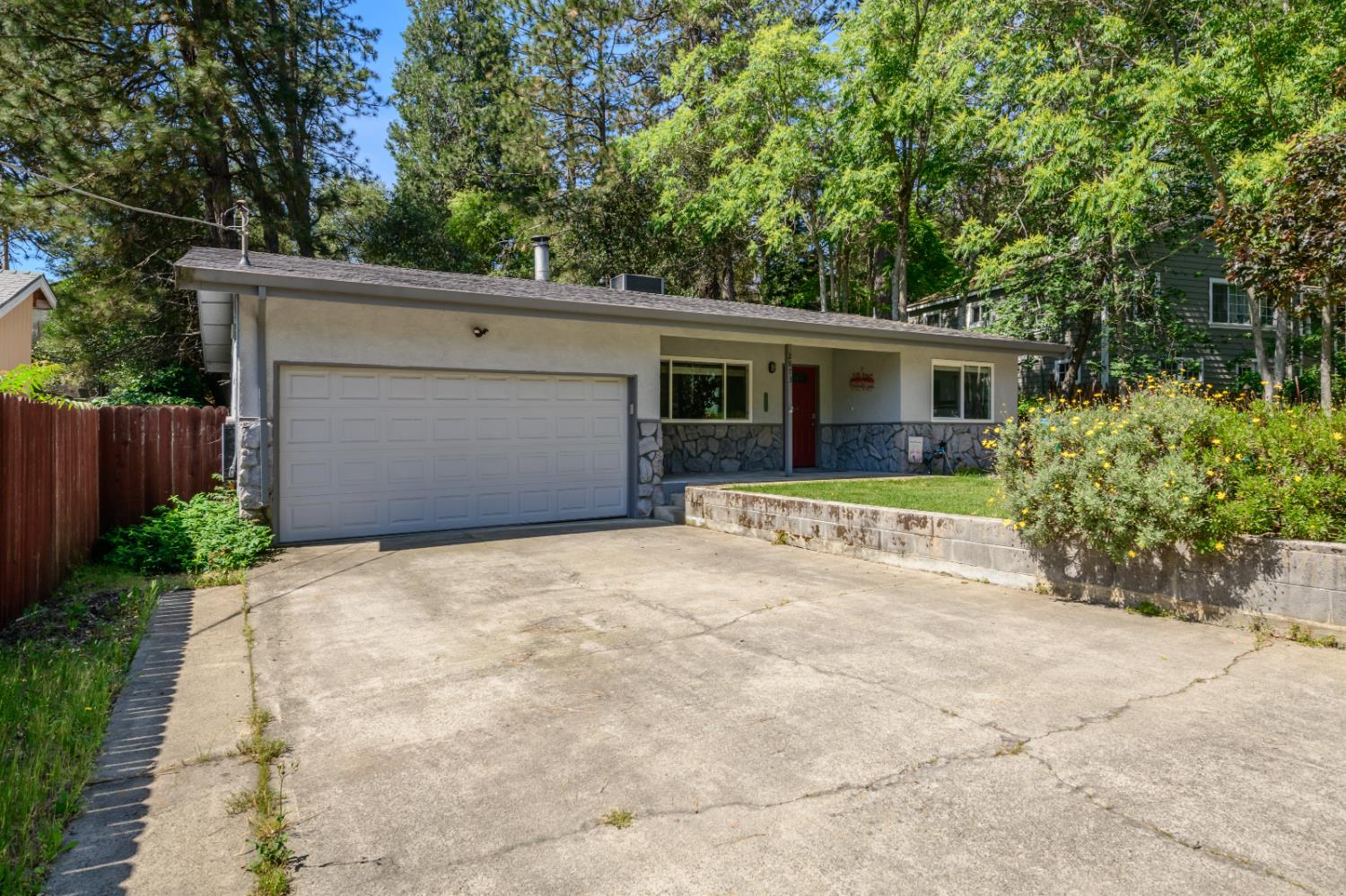 2873 Anderson Way Placerville, CA 95667 - Photo 3 of 24 front view of house with a yard and trees all around