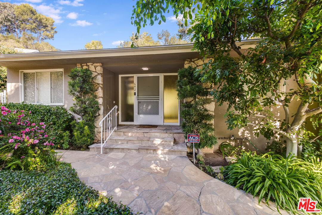 642 Elkins Road Los Angeles, CA 90049 - Photo 1 of 31 front view of a house