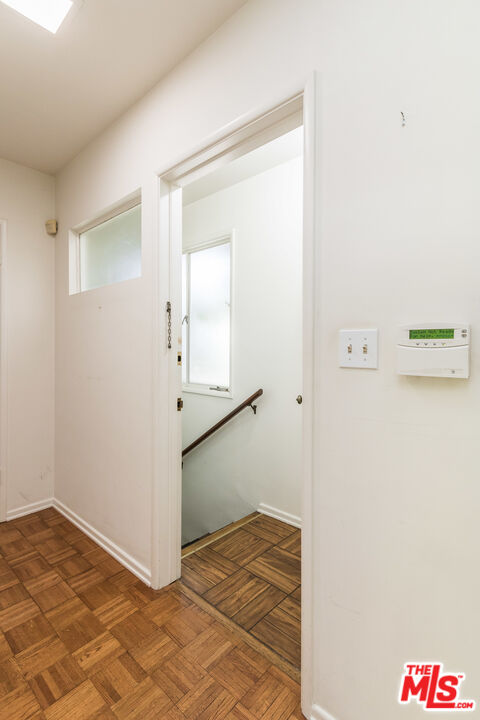 642 Elkins Road Los Angeles, CA 90049 - Photo 14 of 31 a view of a hallway to a bedroom