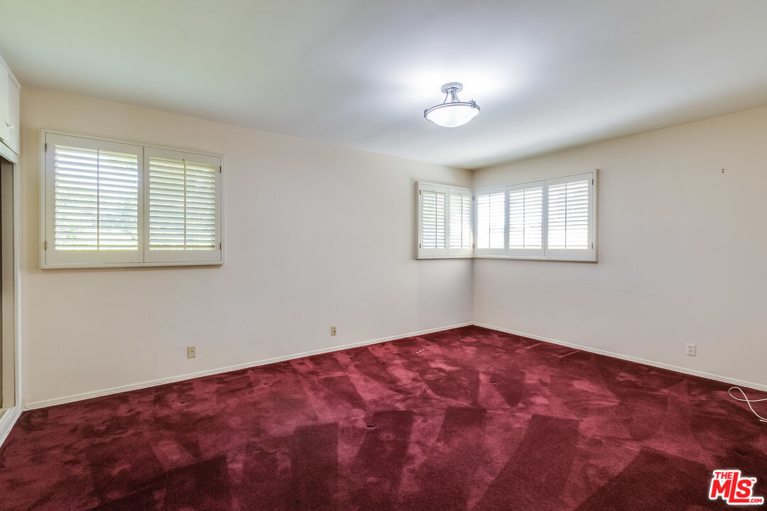 642 Elkins Road Los Angeles, CA 90049 - Photo 16 of 31 a view of an empty room with a window