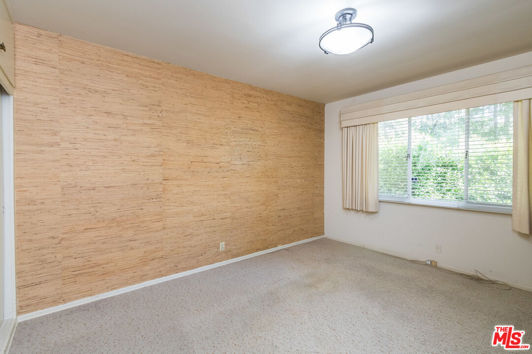 642 Elkins Road Los Angeles, CA 90049 - Photo 20 of 31 a view of an empty room with a window