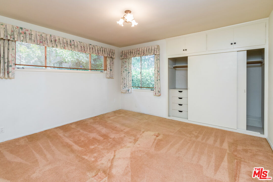 642 Elkins Road Los Angeles, CA 90049 - Photo 22 of 31 a view of an empty room with a window