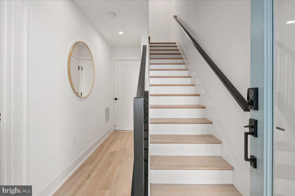 909 North Irving Street Arlington, VA 22201 - Photo 11 of 69 a view of a hallway with wooden floor