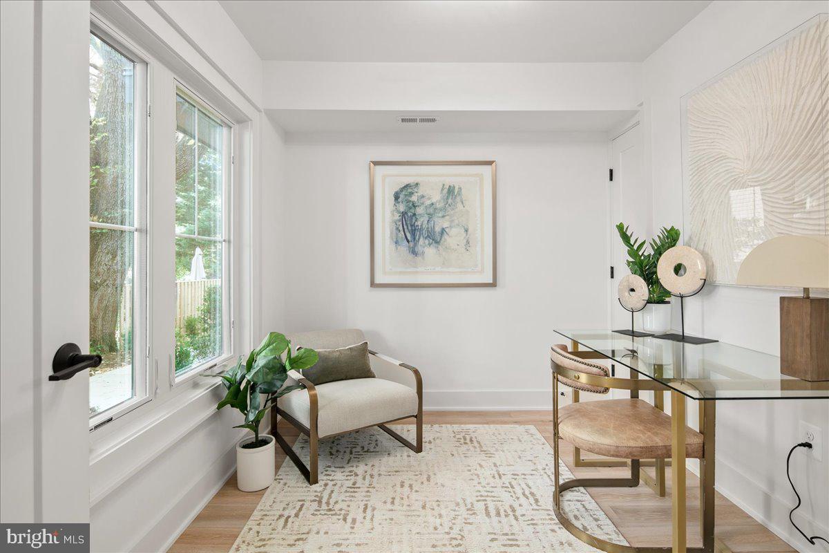 909 North Irving Street Arlington, VA 22201 - Photo 13 of 69 a living room with furniture and a large window