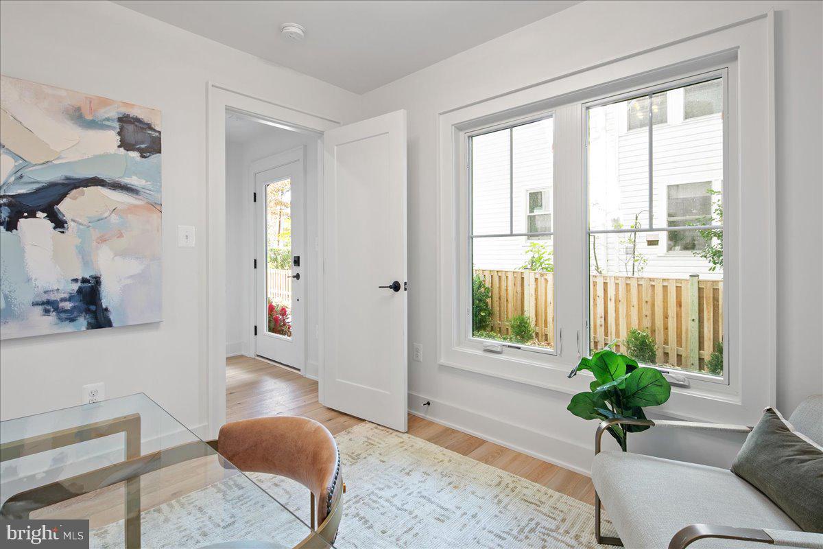 909 North Irving Street Arlington, VA 22201 - Photo 14 of 69 a view of living room filled with furniture and a potted plant