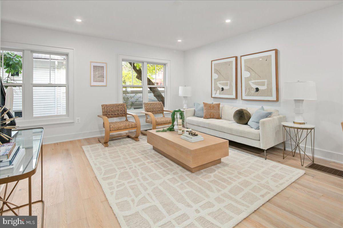 909 North Irving Street Arlington, VA 22201 - Photo 34 of 69 a living room with furniture and a window