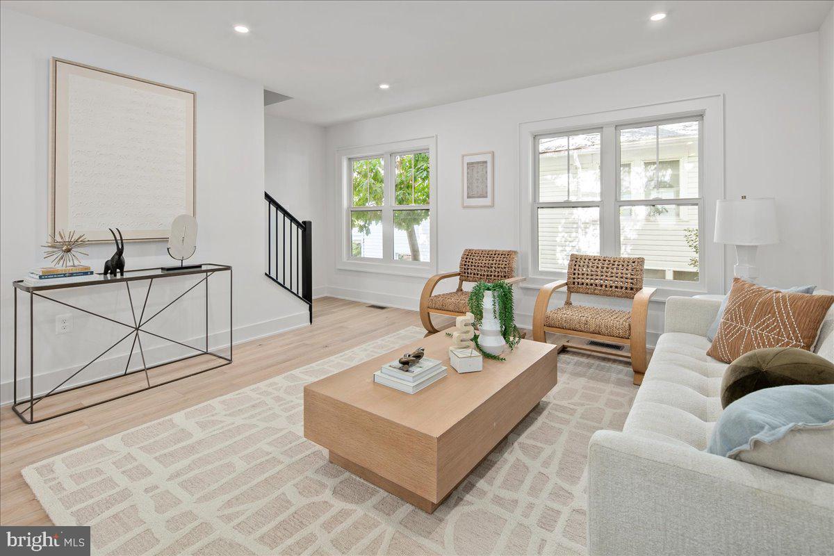 909 North Irving Street Arlington, VA 22201 - Photo 36 of 69 a living room with furniture and a window