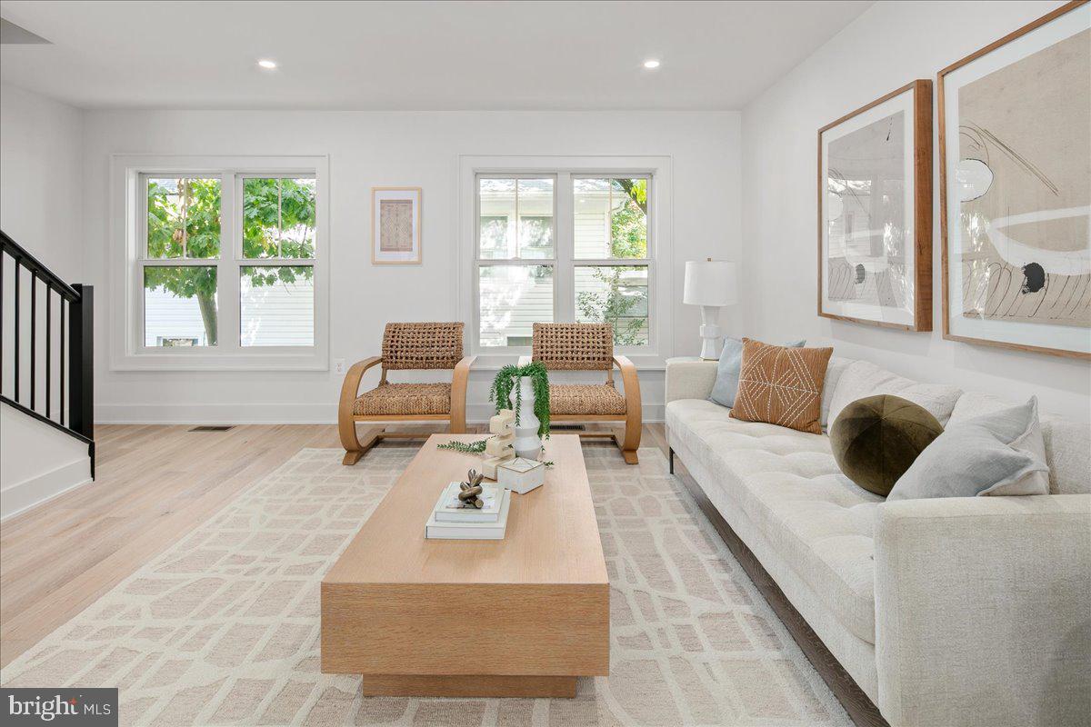 909 North Irving Street Arlington, VA 22201 - Photo 37 of 69 a living room with furniture and a large window
