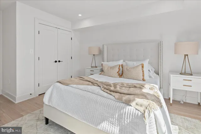 a bedroom with a large bed and a large window