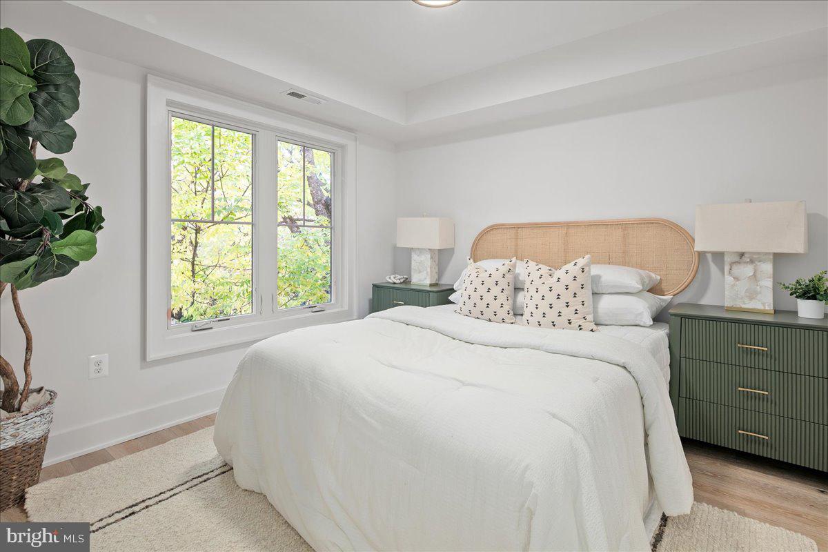 909 North Irving Street Arlington, VA 22201 - Photo 55 of 69 a bedroom with a bed and a window