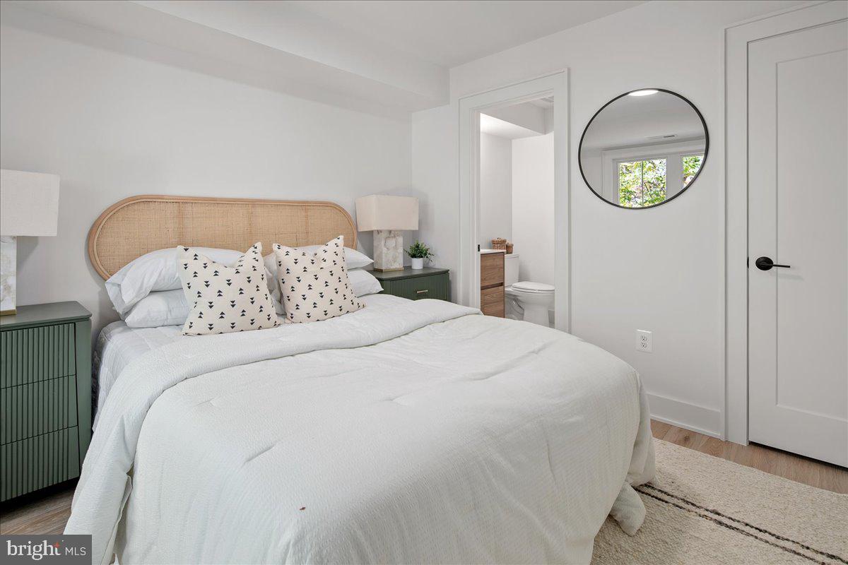 909 North Irving Street Arlington, VA 22201 - Photo 56 of 69 a bedroom with a bed and a painting on the wall