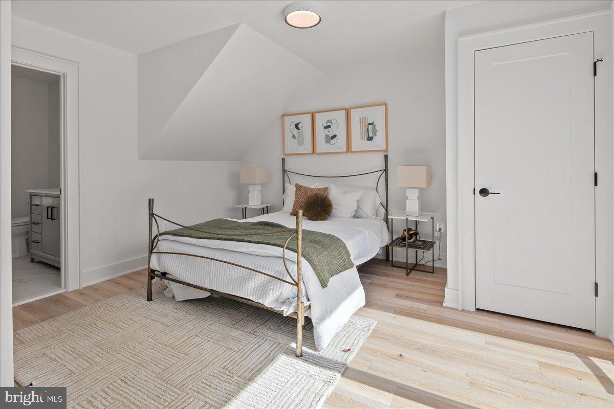 909 North Irving Street Arlington, VA 22201 - Photo 60 of 69 a bedroom with a bed and a cabinets