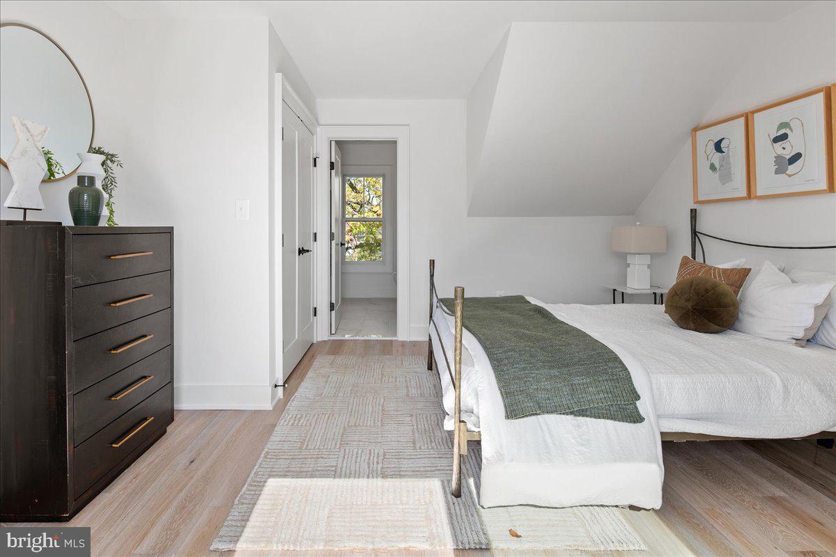 909 North Irving Street Arlington, VA 22201 - Photo 61 of 69 a bedroom with a bed and wooden floor